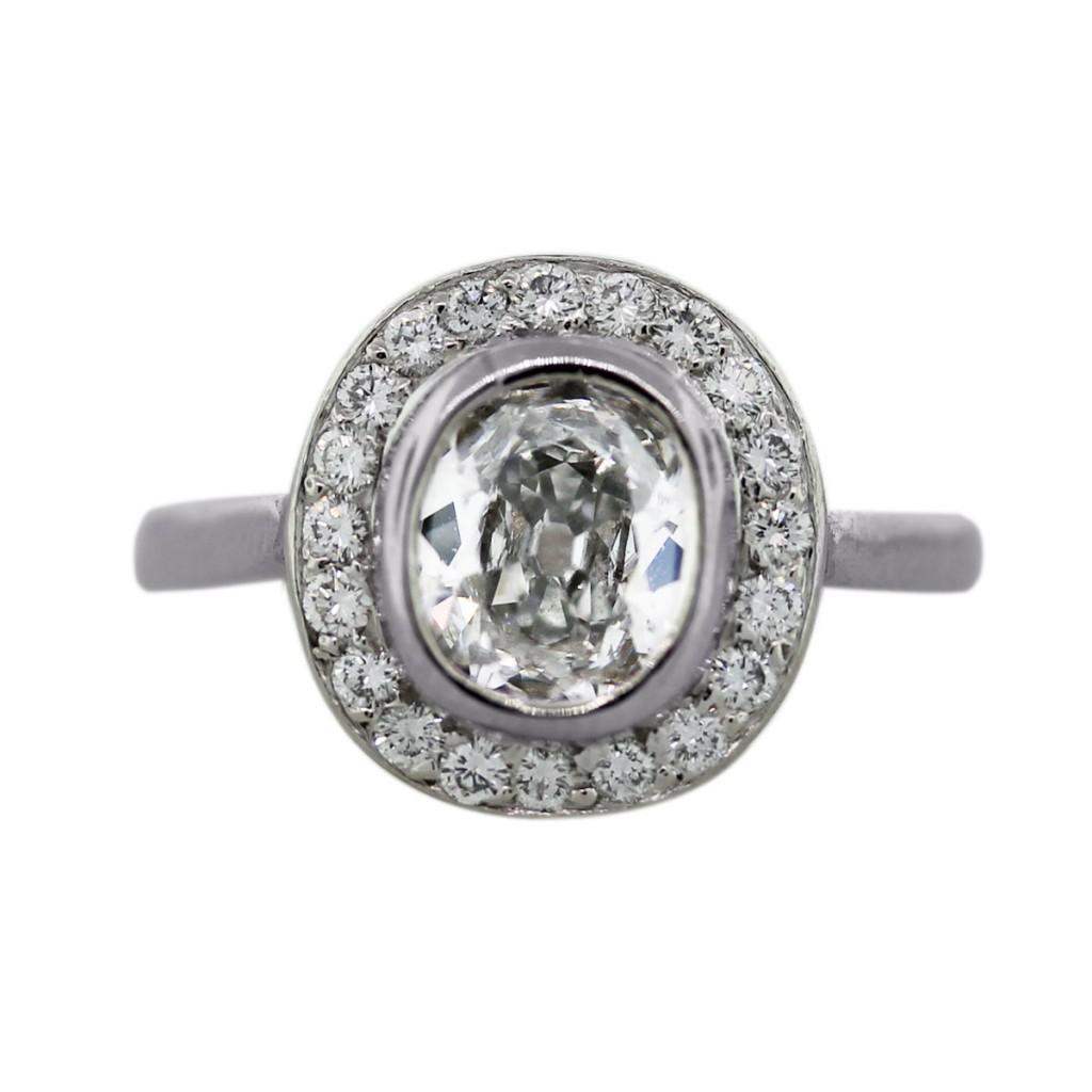 Platinum and cuchion cut diamond halo engagement ring
