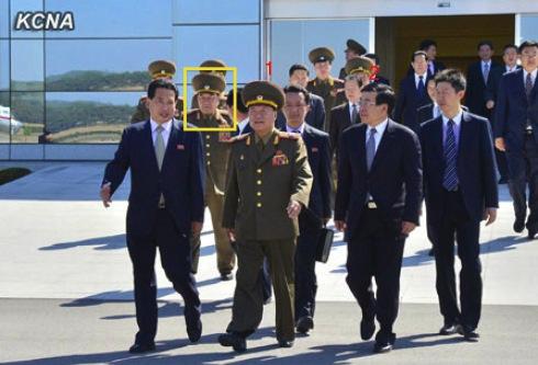 Gen. Kim Kyok Sik (annotated in a yellow box) was part of a group that saw off VMar Choe Ryong Hae (1) and a senior DPRK delegation on a trip to China at Pyongyang Airport on 22 May 2013.  Also seen in attendance is PRC Ambassador to the DPRK Liu Hongcai (2) (Photo: KCNA)