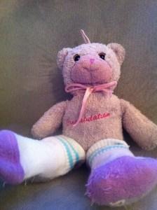 Teddy bear wearing socks