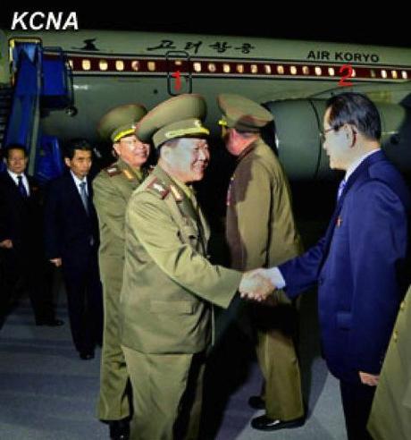 VMar Choe Ryong Hae (1) shakes hands with Kim Yong Il (2), Korean Workers' Party Secretary and Director of the International Affairs Department, after arriving at Pyongyang Airport on 24 May 2013 from a three day visit to China (Photo: KCNA).