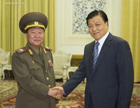 VMar Choe Ryong Hae (L), a special envoy of DPRK supreme leader Kim Jong Un, shakes hands with CPC Secretary Liu Yunshan (R) in Beijing on 23 May 2013 (Photo: Xinhua)