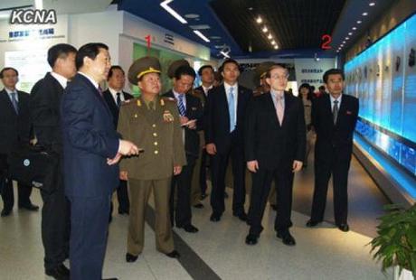 Choe Ryong Hae (1) tours the Beijing Economic and Technological Development Park.  Also in attendance is Kim Song Nam (2), Deputy Director of the KWP International Affairs Department (Photo: KCNA).