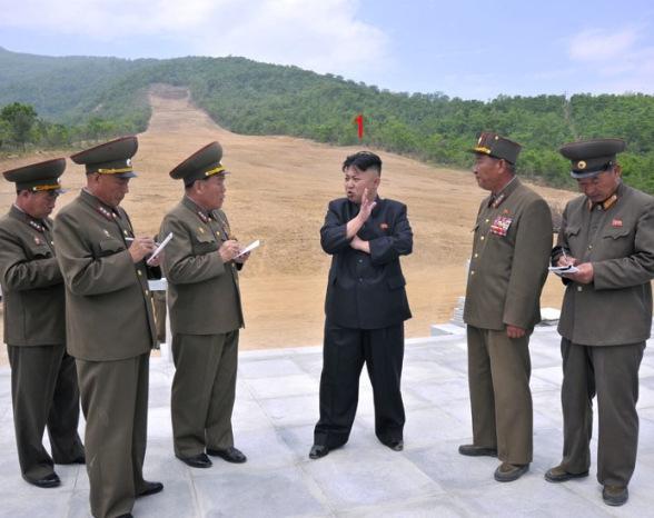 Kim Jong Un stands at the bottom of a ski slope during his visit to the construction of the Masik Pass Ski Park in Kangwo'n Province (Photo: Rodong Sinmun).