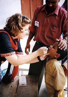 Child receives oral polio vaccine. (Via Wikipedia; used under CC license.)
