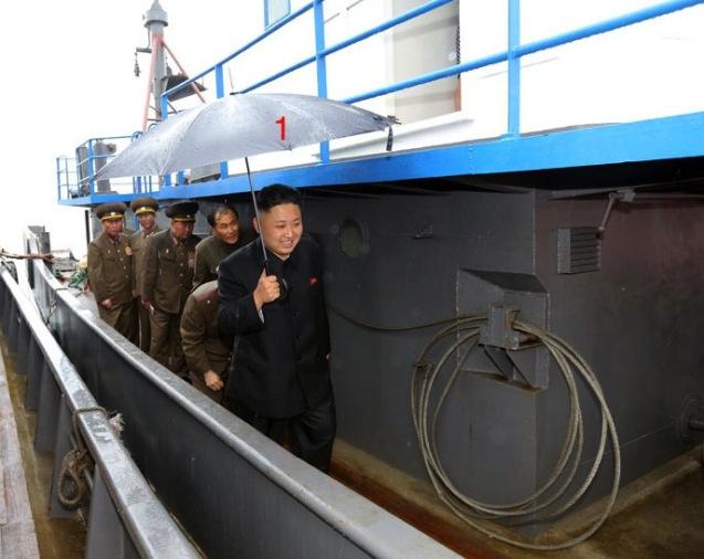 Kim Jong Un (1) on the deck of a fishing vessel during a visit to the fishery station of KPA Unit #313 (Photo: Rodong Sinmun).
