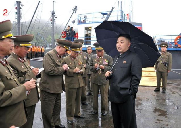 Kim Jong Un (1) talks with senior KPA officials prior to touring a fishing boat during a visit to the fishery station of KPA Unit #313.  Also seen in attendance are Chief of the Chief of the KPA General Staff Operations Bureau Col. Gen. Ri Yong Gil (2), Chief of the KPA General Staff Gen. Kim Kyok Sik (3) and Director of the KPA General Political Department VMar Choe Ryong Hae (4) (Photo: Rodong Sinmun).