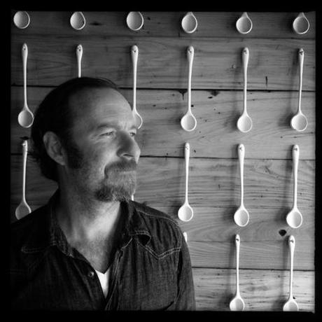 Joshua Vogel of Black Creek Mercantile & Co. with his Spoon mural. 