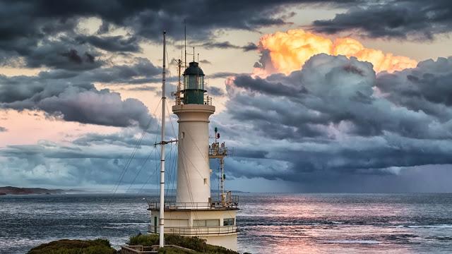 point lonsdale lighthouse and ocean during setting sun
