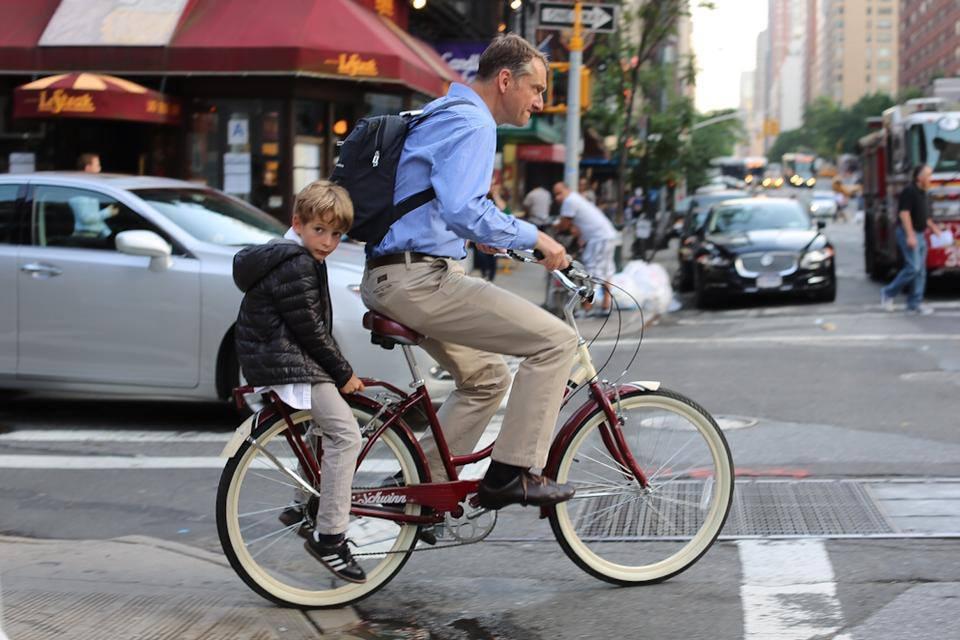 humansofnewyork:

From the look on Dad’s face, they’re on pace for a record breaking time.

WTF, Dad - no helmets? Your kid is old enough to ride his own bike, but you have him on the back of yours like a package. Just fit him for the wheelchair already. Dick. 