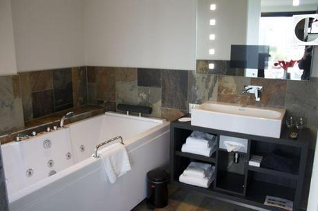 Jacuzzi tub and tv built right into the bathroom mirror.