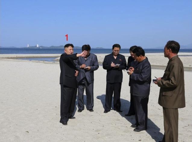 Kim Jong Un (1) issues instructions while touring a beach at Songdowon International Children's Camp in Wo'nsan, Kangwo'n Province on the DPRK's east coast (Photo: Rodong Sinmun)