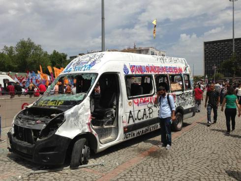 Istanbul Government Truck, one of many destroyed last night. Graffiti reads 