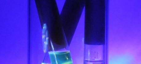 This image shows novel cadmium selenide (CdSe) quantum dots with ligand enhancement chemistry. The vials on the left contain quantum dots; the vial on the right contains solvent without quantum dots. (Credit: Delaina Amos)