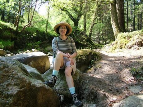 jean sits near poulanass waterfalls trail - wicklow mountians national park - ireland