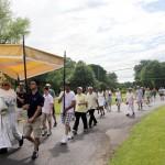 Msgr. Joseph Prior, pastor of St. John the Evangelist Parish in Morrisville, leads the procession from St. Ignatius Church, Yardley, up the driveway of St. John's for the final benediction and conclusion of the Corpus Christi procession. (Photos by Sarah Webb)