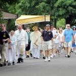 On his first day of his new assignment as a newly ordained deacon, Deacon Charles Ravert carries the eucharist through the streets of Lower Makefield.