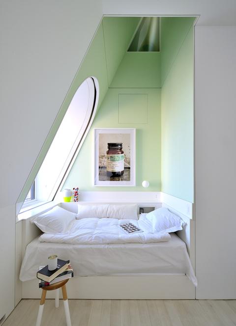 Architect David Hotson and interior designer Ghislaine Viñas designed the alcove attic bedroom in this four-story penthouse in New York City