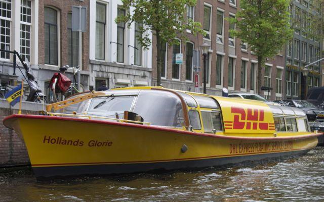 Courier boat on a canal in Amsterdam.