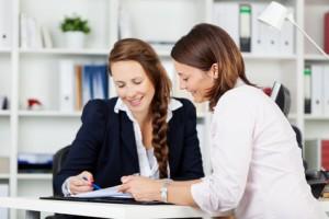 Wedding Planner Presenting Proposal To Bride