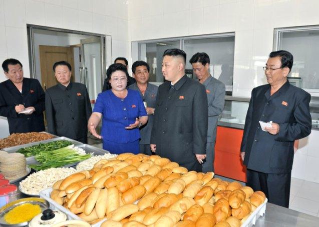 Kim Jong Un holds a cigarette while touring a kitchen in Ch'angso'ng County, North P'yo'ngan Province (Photo: Rodong Sinmun).