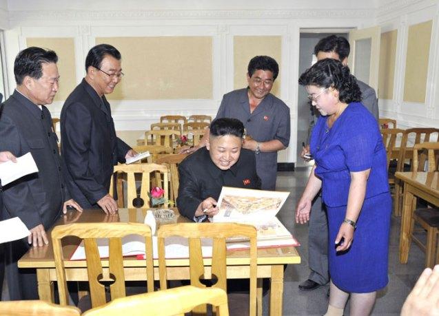 Kim Jong Un reads a menu at the Ch'angso'ng Restaurant (Photo: Rodong Sinmun).