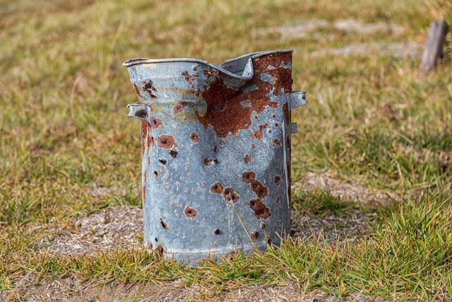 bin with bullet holes