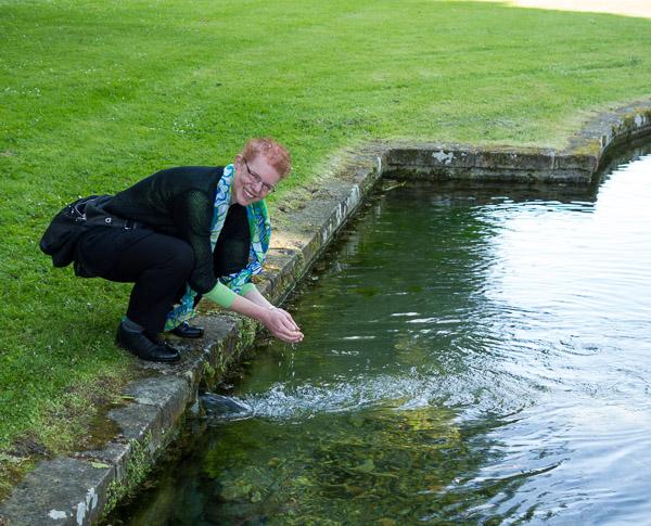 photo of me drinking water from a spring