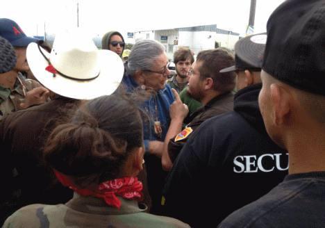 Oglala Sioux President Brewer being harassed before arrest. 