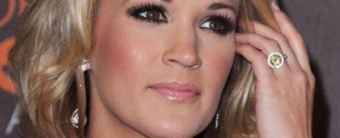 Carrie Underwood engagement ring with a fancy yellow diamond center