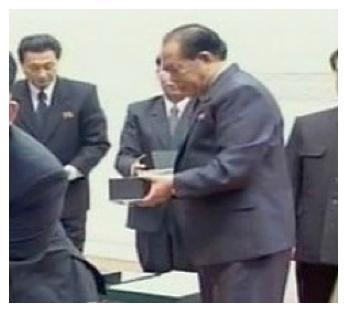 Gifts office employees assist Kim Jong Un with a watch presentation ceremony held in Pyongyang in February 2013 (Photo: KCNA-Yonhap)