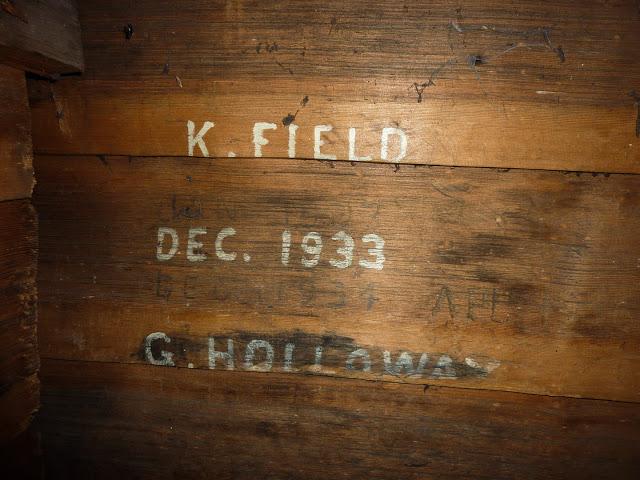 name written on wall inside old pelion hut