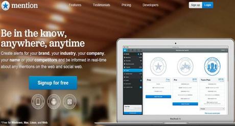 Mention.net Website homepage showing Apple Macbook air with Logo