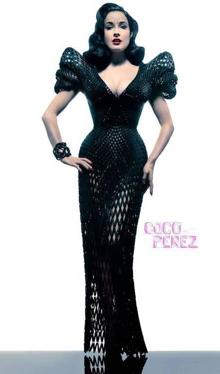 Dita Von Teese wearing the worlds first 3D printed dress, made from Powdered Nylon and Swarovski crystals, By designer Michael Schmidt. 
An amazing advance in technology or what?!
However I cant help but wonder about the impact of 3D printing on the environment, since it deals almost exclusively in plastic at a time when we already produce around 300 Million tones of plastic each year on this planet - only a fraction of which is ever recycled. Even if it is recycled, most plastic can only go through the process once or twice before it degrades and eventually will end up in landfill anyway. 
So although i see the amazing merits of advanced technology such as this, I feel like we should be doing something more productive to cut our plastic problem, especially in such a huge industry as fashion, which is known for producing huge amounts of waist, not least of which is through the use of non biodegradable products such as Nylon.
The dress is stunning, sure! Especially worn by the queen of Burlesque herself, Dita Von Teese. Just a shame its not made from silk or plant matter. 
xoxo LLM