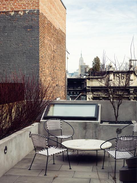 Visible skylights on outdoor roof terrace.