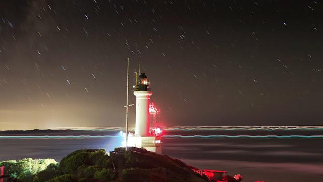 lights of ship passing point lonsdale lighthouse night
