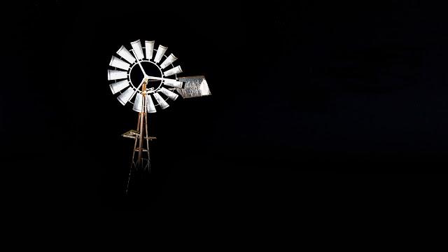 windmill at night lit by flash