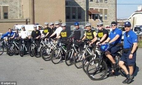 Chance encounter: More than two dozen police officers from various departments were taking part in an annual five-day bicycle school when they stumbled upon the kinky couple 