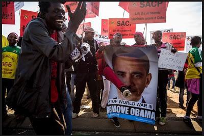 Angry Protesters Burn Obama's Picture In South Africa, Call Him A Killer (Video)