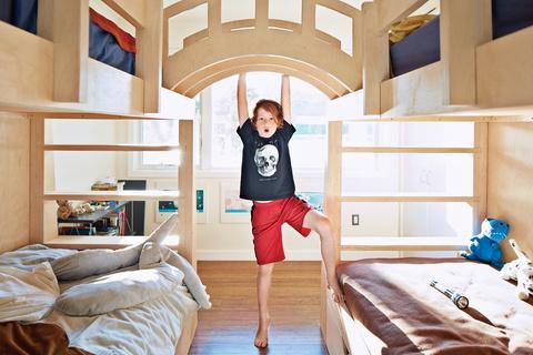 Modern kids bedroom with wooden connecting bunk beds