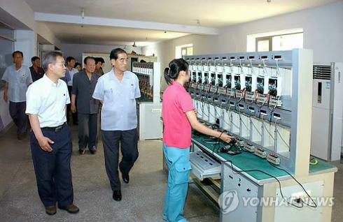 DPRK Premier Pak Pong Ju (2nd R) tours the Pyongyang Electrical Appliances Joint Venture Company (Photo: KCNA-Yonhap).