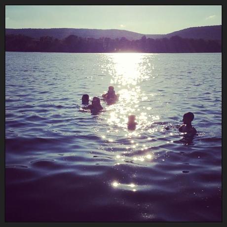 Sunset results in the neighborhood kids congregating on our dock for a swim through the sparkling waters.