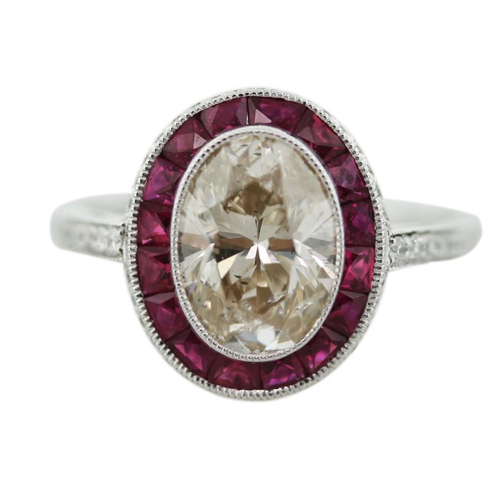 Oval diamond and ruby engagement ring