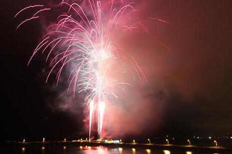 Explosion of fireworks above Ocean Beach pier