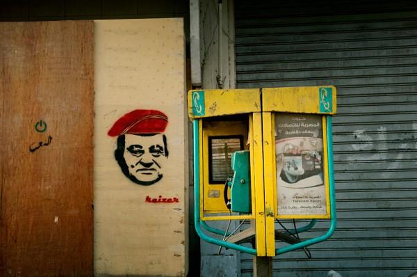 Stencil portrait of Mubarak wearing a military cap by Kaizer