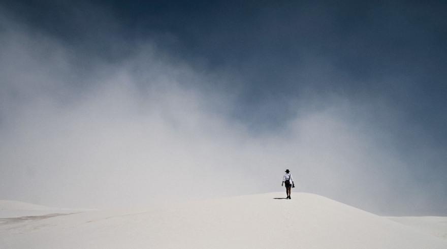 Charlene in a sandstorm in wide open spaces at White Sands, New Mexico.