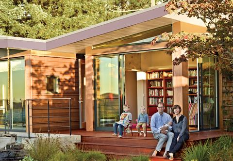 The Gimon family sitting outside their 1950s Esherick home