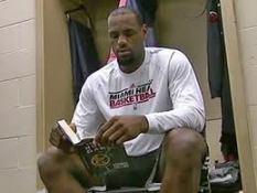 LeBron James reads The Hunger Games in the locker room.