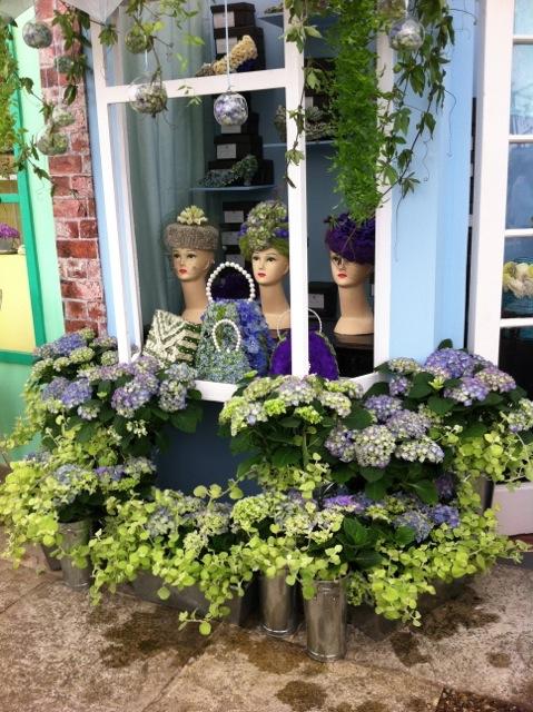 Impressive and colourful floral display of a hat shop