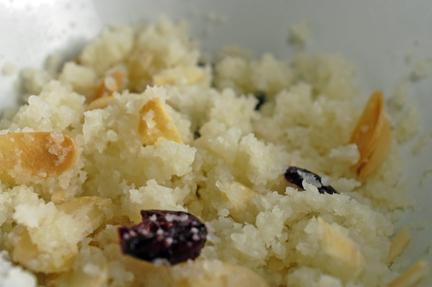 Cauliflower couscous with butter, roasted sliced almonds, and dried cranberries