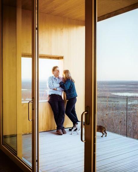 Alaska modern house portrait through sliding doors by Kamil Bialous